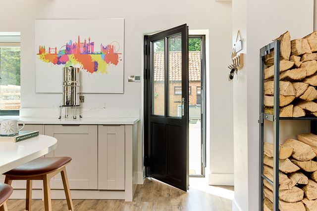 black aluminium front door in kitchen interior