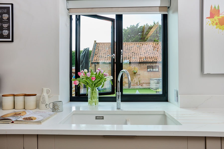 Black aluminium window in kicthen interior close up