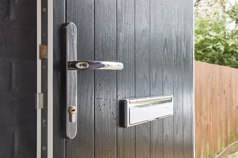 Close up of chrome composite front door handle and letterplate from Anglian Home Improvements