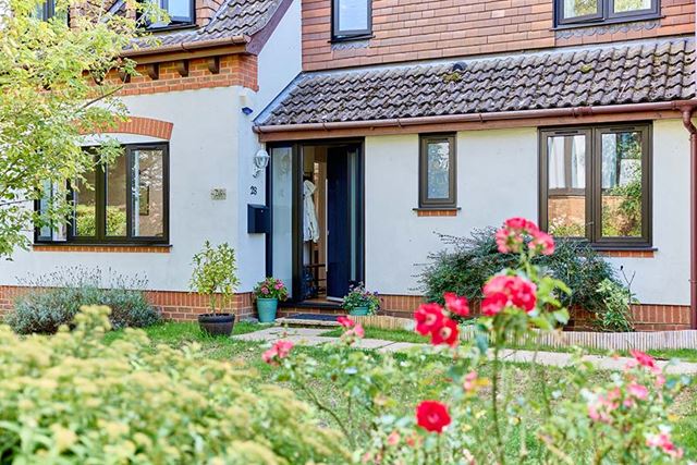 Blakc uPVC flush casmenent windows with black front door