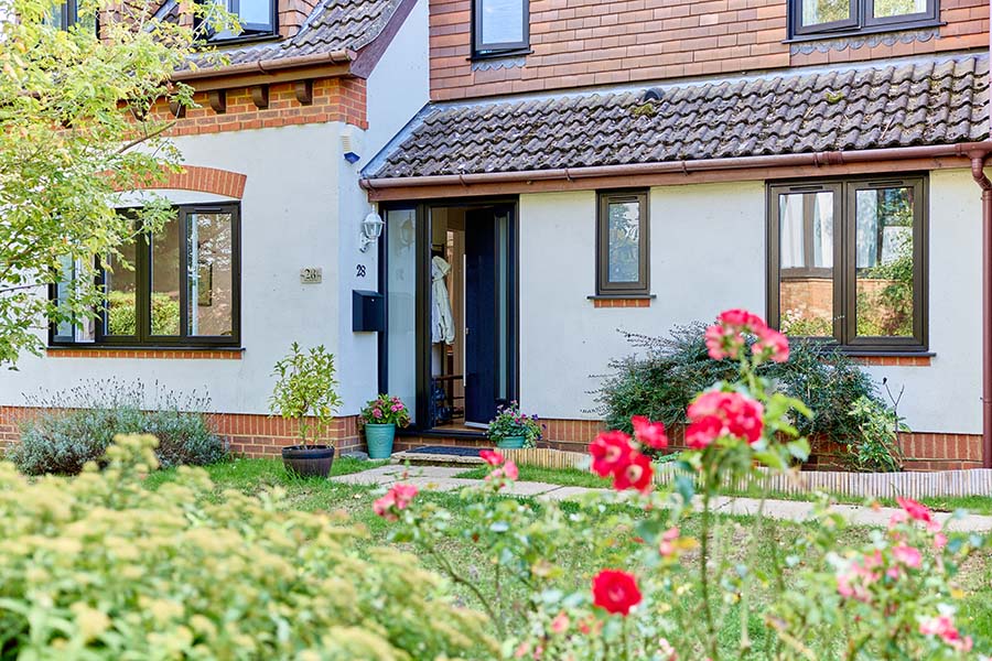 Blakc uPVC flush casmenent windows with black front door