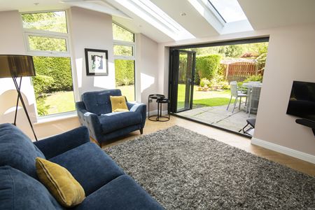 CosyRoom Extension with black aluminium Bifold Doors