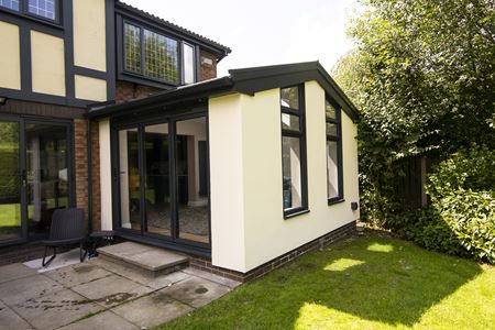 CosyRoom Extension with pitched roof & black aluminium Bifold doors