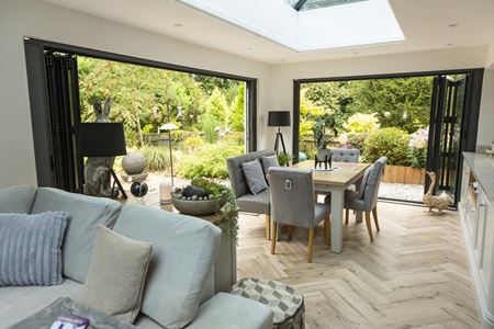 CosyRoom Orangery with two sets of open aluminium Black Bifold doors