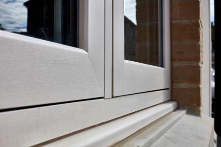 Cream uPVC flush window close up