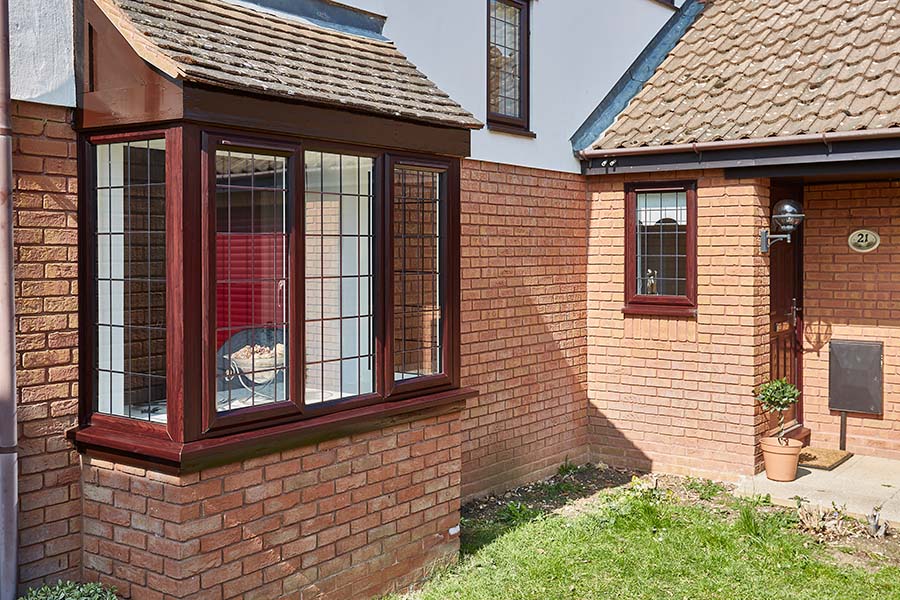 Dark woodgrain uPVC bay window