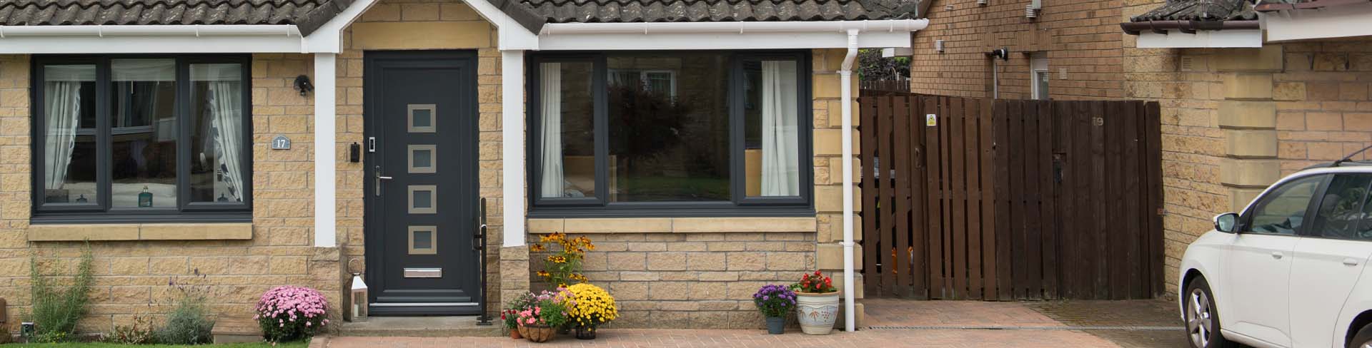 Dual anthracite grey uPVC Wessex front door with anthracite grey casement windows