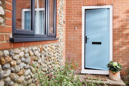 Duck Egg Blue GRP classic door and Anthracite Grey uPVC casement windows