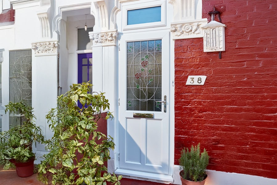 front door with stained rose glass