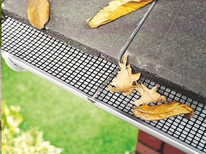 Gutter guard on white uPVC guttering from the Anglian guttering range