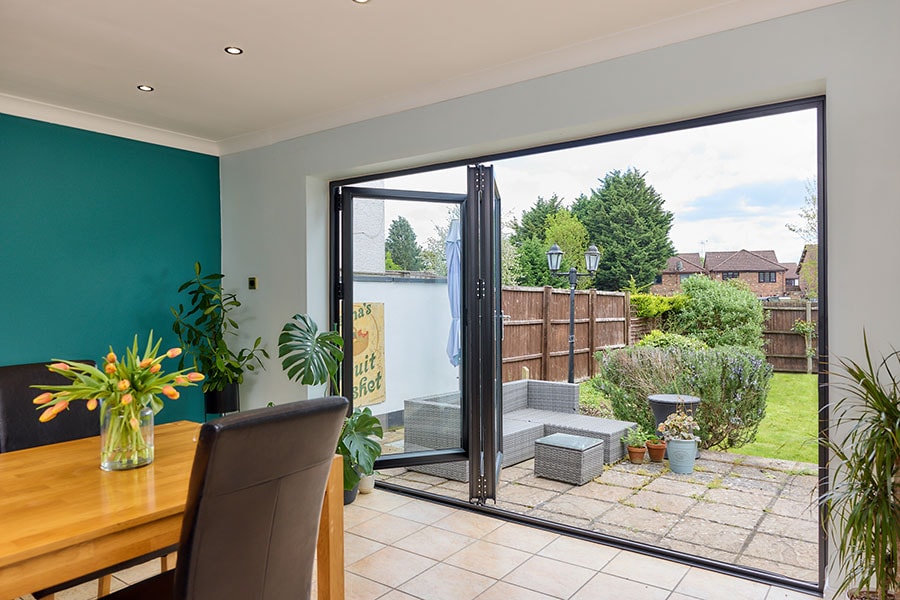 Jet black aluminium bifold door interior in open position