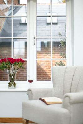 White wooden cottage style living room window with chrome window handle from the Anglian cottage window range