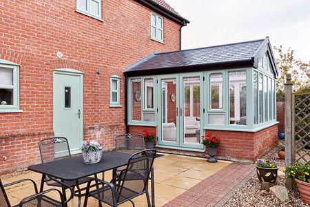 Sage green extension with replica tile roof