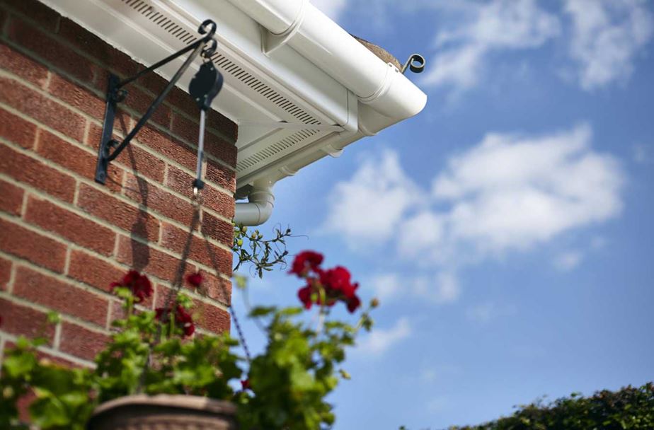 After white UPVC guttering and downpipes from the Anglian roofline range