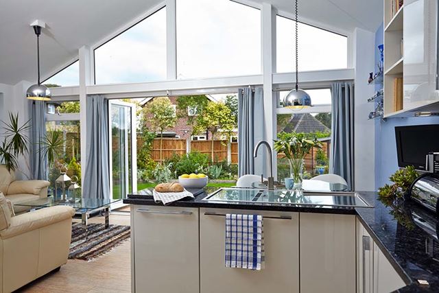 Solid roof extension with aluminium bifold doors interior