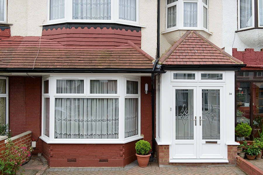 Traditional white uPVC bay window and Front door