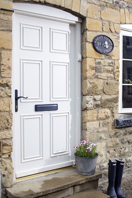 Traditional timber door finished in white