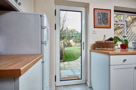 white aluminium back door in kitchen interior