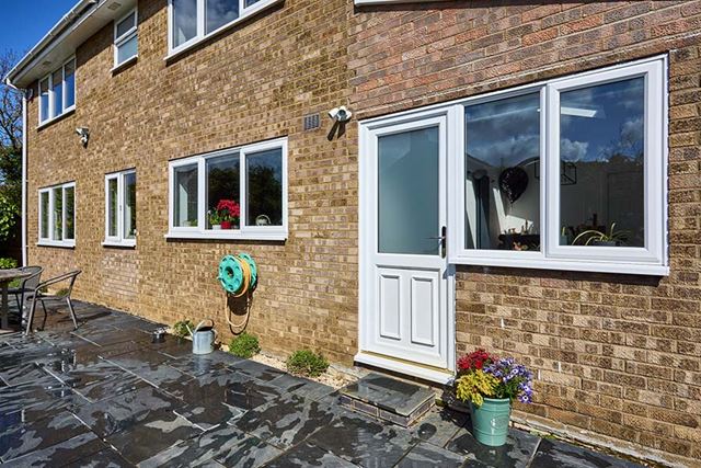 White casement windows and back door in uPVC
