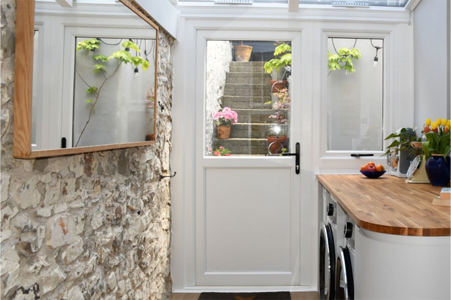White uPVC back door with glass panel and side window