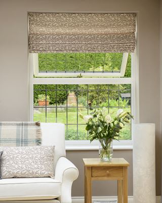 Double glazed UPVC casement window finished in White with leaded bars from the Anglian UPVC windows range