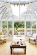 Inside UPVC Elizabethan conservatory finished in White with tall roof and French doors opening onto patio from Anglian Home Improvements