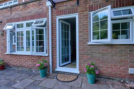 White uPVC Flush casement windows and back door with Georgian bars