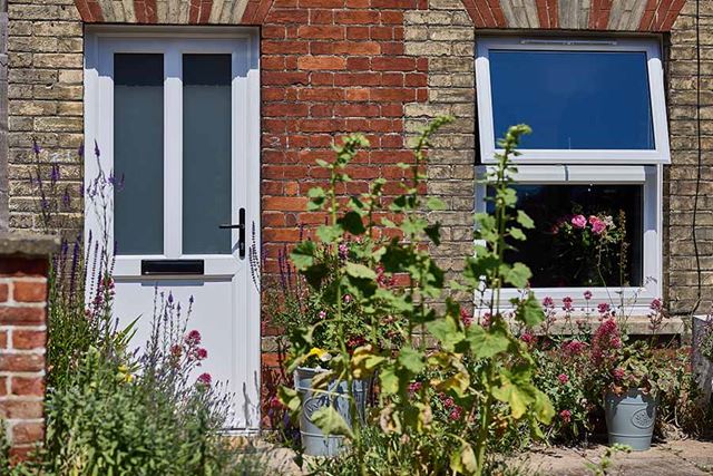 White uPVC front door with obscure glass with window in open position