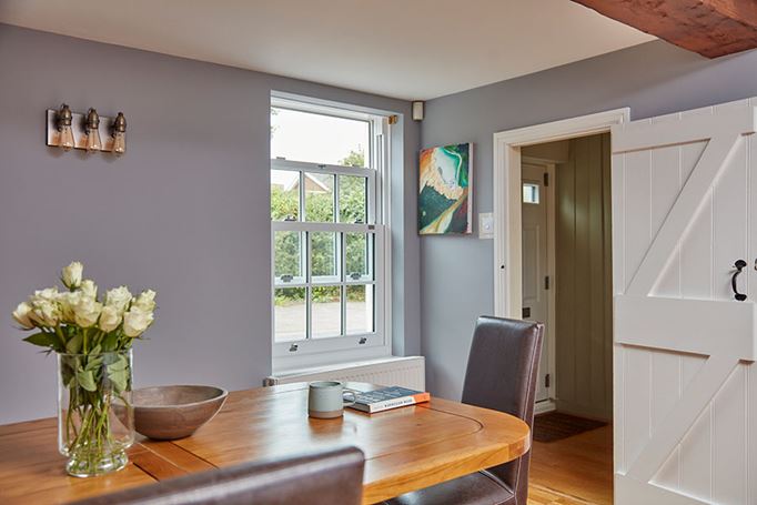 White uPVC sliding sash window in dining room