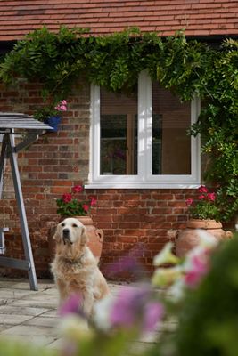 Exterior view of triple glazed UPVC casement window finished in white from the Anglian triple glazing range