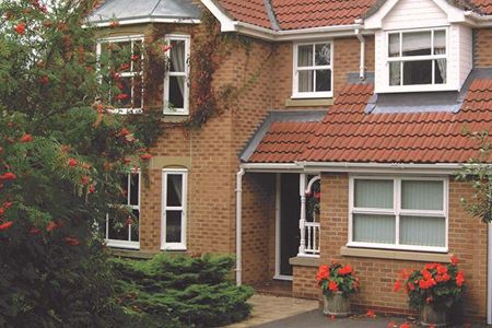 White Victorian window with shutters