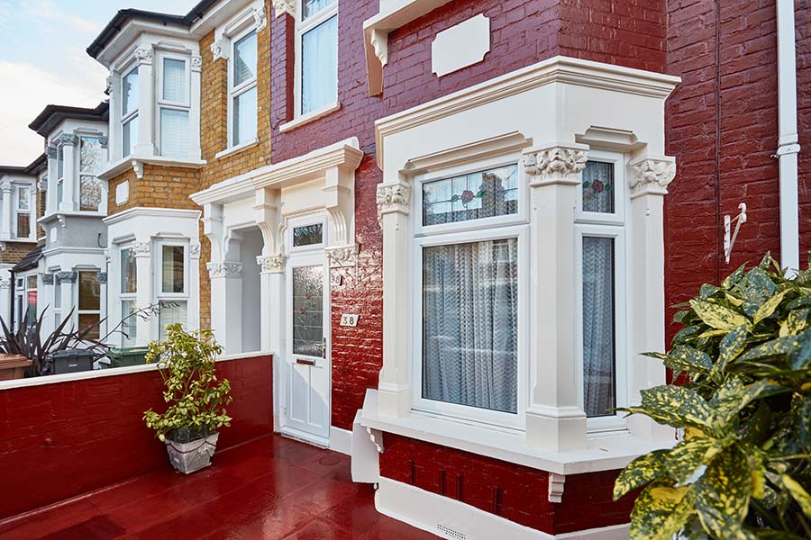 White window and front door with rose stained glass