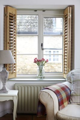 Living room wooden double glazed casement window in White with cottage bars from Anglian Home Improvements