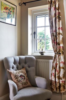 Traditional White wooden casement window with cottage bars in hallway from the Anglian timber window range