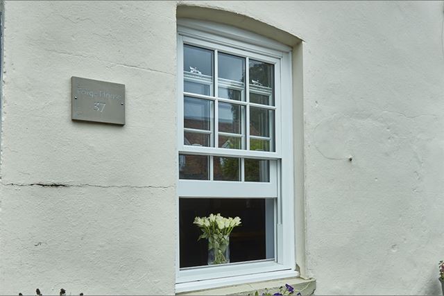 White woodgrain uPVC sash window