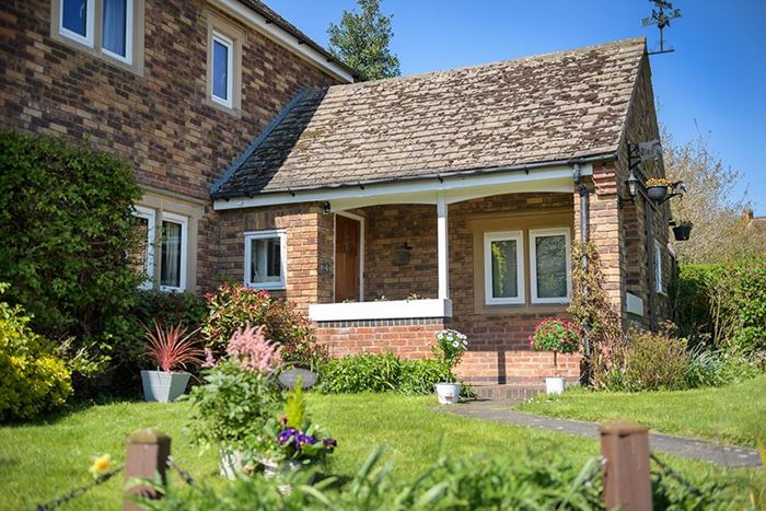Whole house with white aluminium casement windows