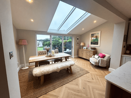 CosyRoom Extension with two large roof lights and white aluminium Bifold doors