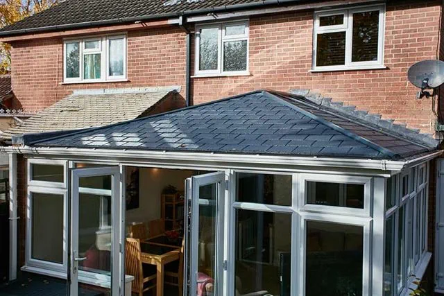 Conservatory with solid roof and uPVC windows Anglian Home UK