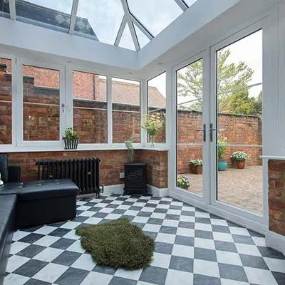 White uPVC Elizabethan conservatory with solar glass roof and Georgian bars interior